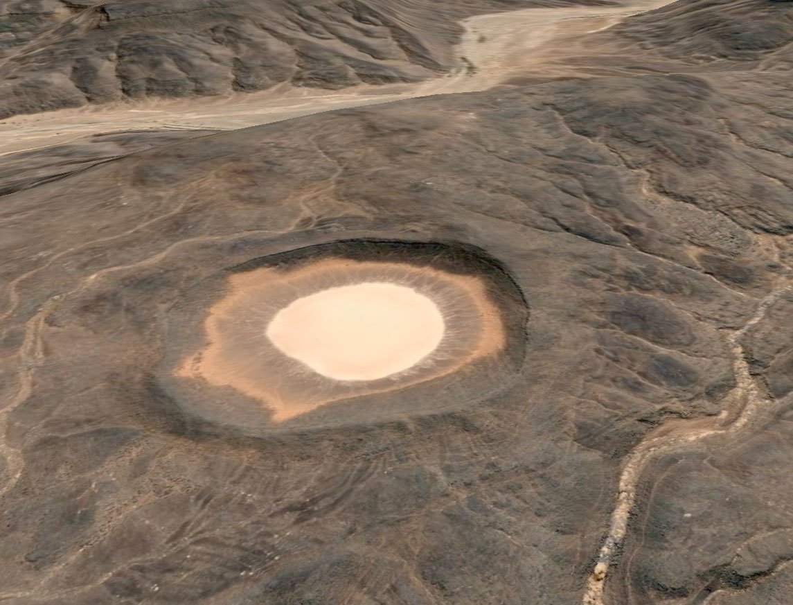 Самый крупный кратер на земле. Ударный кратер Вредефорт. Кратер Бэрринджера. Кратер Амгуид. Метеоритные кратеры на земле.